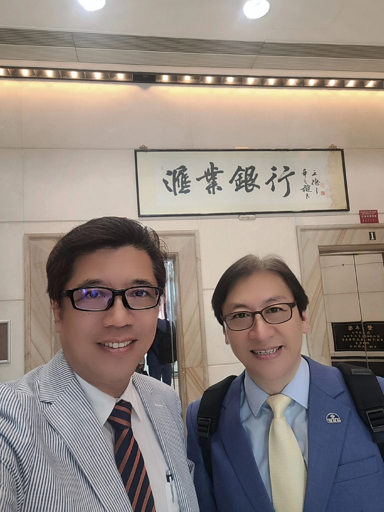 Dr. Chang and Mr. Lai took photo at client's office